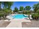 Sparkling community pool surrounded by lush landscaping, featuring clear blue water and comfortable lounge chairs for relaxation at 10136 E Isleta Ave, Mesa, AZ 85209