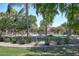 Beautiful community pool surrounded by trees and lush landscaping, creating a serene and inviting outdoor space at 10136 E Isleta Ave, Mesa, AZ 85209