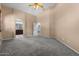 Spacious bedroom with carpet, high ceilings, neutral walls, and en suite bath with dual vanity at 10235 E Jerome Ave, Mesa, AZ 85209
