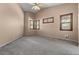 Spacious bedroom with carpet, high ceilings, neutral walls, and bright natural light through the many windows at 10235 E Jerome Ave, Mesa, AZ 85209