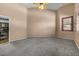 Large bedroom with carpet, high ceilings, neutral walls, and views into the en suite bath at 10235 E Jerome Ave, Mesa, AZ 85209