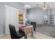 Cozy dining area with a table set for two, leading to a patio at 10235 E Jerome Ave, Mesa, AZ 85209