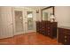 Spacious bedroom with tile flooring, dresser, mirror and patio doors at 10523 E Sleepy Hollow Trl, Gold Canyon, AZ 85118