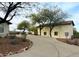 Scenic driveway leading to a charming home with lush desert landscaping, offering privacy and curb appeal at 10523 E Sleepy Hollow Trl, Gold Canyon, AZ 85118