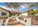 Charming home exterior with stone walkway, desert landscaping, and a warm, inviting facade at 10523 E Sleepy Hollow Trl, Gold Canyon, AZ 85118