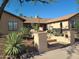 Southwestern home with desert landscaping, barrel cactus and a step-up entry at 10523 E Sleepy Hollow Trl, Gold Canyon, AZ 85118