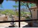 View of the fountain and desert landscaping from inside the home at 10523 E Sleepy Hollow Trl, Gold Canyon, AZ 85118