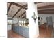 Open-concept kitchen with spacious island, stainless steel appliances, and seamless flow into living area at 10523 E Sleepy Hollow Trl, Gold Canyon, AZ 85118