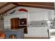 Stylish kitchen with stainless steel appliances, subway tile backsplash, and convenient center island at 10523 E Sleepy Hollow Trl, Gold Canyon, AZ 85118
