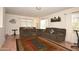 Open living room with plush sofas, a colorful rug, and ample natural light from window views at 10523 E Sleepy Hollow Trl, Gold Canyon, AZ 85118