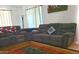 Cozy living room featuring a soft couch and a rug with lovely colors. The perfect place to relax and unwind at 10523 E Sleepy Hollow Trl, Gold Canyon, AZ 85118