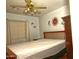 Bedroom featuring a wooden bed frame, ceiling fan with light, and window with blinds at 10523 E Sleepy Hollow Trl, Gold Canyon, AZ 85118