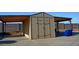 Outbuilding on concrete pad with extended awnings and decorative door hardware at 10523 E Sleepy Hollow Trl, Gold Canyon, AZ 85118