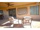 Cozy covered patio with comfortable seating and decorative features at 10523 E Sleepy Hollow Trl, Gold Canyon, AZ 85118