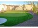 Backyard putting green featuring sand trap, lights, and desert landscaping at 10523 E Sleepy Hollow Trl, Gold Canyon, AZ 85118