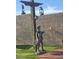 Whimsical yard sculpture with vintage lanterns, enhancing the outdoor space's charm and character at 10523 E Sleepy Hollow Trl, Gold Canyon, AZ 85118