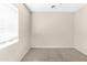 Bedroom with neutral carpet, a window, and ample space for personalization at 10702 W Orangewood Ave, Glendale, AZ 85307