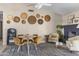 Cozy dining room with stylish seating, a fireplace, and unique wall decor at 10702 W Orangewood Ave, Glendale, AZ 85307