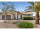 Charming single-story home with desert landscaping, a two car garage, and mature palms at 10702 W Orangewood Ave, Glendale, AZ 85307