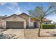 Charming single-Gathering home with a two-car garage and low-maintenance desert landscaping at 10702 W Orangewood Ave, Glendale, AZ 85307