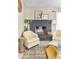 Charming fireplace with decorative accents, comfortable seating, and natural light at 10702 W Orangewood Ave, Glendale, AZ 85307