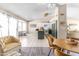 Bright kitchen with stainless steel appliances, white cabinets, and a breakfast bar island at 10702 W Orangewood Ave, Glendale, AZ 85307