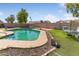 Beautiful pool with patio and landscaping, enhancing the outdoor living experience of this home at 10702 W Orangewood Ave, Glendale, AZ 85307