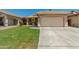 Charming single-story home with a well-manicured lawn, a two-car garage, and inviting curb appeal at 11206 W Coronado Rd, Avondale, AZ 85392