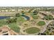 Scenic aerial view of the golf course with lush landscaping and beautiful homes in the community at 11550 W Mule Deer Ct, Surprise, AZ 85378