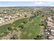 This aerial shows the community's sprawling golf course, lake and the residential area at 11550 W Mule Deer Ct, Surprise, AZ 85378