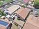 Birds eye view of a home with a tile roof, patio, and solar panels at 11550 W Mule Deer Ct, Surprise, AZ 85378