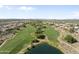 Beautiful aerial shot of the golf course, showcasing its manicured greens and scenic desert surroundings at 11550 W Mule Deer Ct, Surprise, AZ 85378