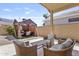 Inviting backyard with patio furniture, a cozy gazebo, and low-maintenance landscaping at 11550 W Mule Deer Ct, Surprise, AZ 85378