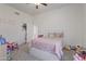 Bedroom featuring a bed, closet, and toys at 11550 W Mule Deer Ct, Surprise, AZ 85378