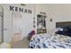 Bedroom with a themed bed, closet, and doorway to the hall at 11550 W Mule Deer Ct, Surprise, AZ 85378