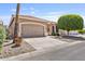 Charming house featuring a tile roof, two-car garage, and manicured landscaping for great curb appeal at 11550 W Mule Deer Ct, Surprise, AZ 85378