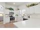 Bright kitchen featuring stainless steel appliances, white cabinetry, and modern countertops at 11550 W Mule Deer Ct, Surprise, AZ 85378