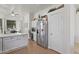 Bright kitchen featuring stainless steel appliances, white cabinetry, and an eat-in area at 11550 W Mule Deer Ct, Surprise, AZ 85378