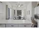 Bright eat-in kitchen featuring white cabinets, a view to the yard, and modern countertops at 11550 W Mule Deer Ct, Surprise, AZ 85378