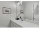 Modern bathroom featuring dual vanity sinks, updated fixtures, and elegant decor at 11717 W Red Hawk Dr, Peoria, AZ 85383