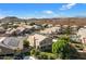 Aerial view of a suburban neighborhood with desert landscaping and mountain views at 1216 E Rocky Slope Dr, Phoenix, AZ 85048