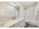 Elegant bathroom with double sinks, marble counters, and a combined tub and shower at 1216 E Rocky Slope Dr, Phoenix, AZ 85048
