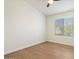 Sunlit bedroom with sleek wood floors and a window bringing natural light and views at 1216 E Rocky Slope Dr, Phoenix, AZ 85048