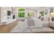 Bright bedroom boasts a fireplace, hardwood floors, and large windows with scenic outdoor views at 1216 E Rocky Slope Dr, Phoenix, AZ 85048
