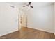 An empty bedroom featuring hardwood flooring and a ceiling fan at 1216 E Rocky Slope Dr, Phoenix, AZ 85048