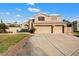 Exterior view of home with stucco and driveway with three car garage at 1216 E Rocky Slope Dr, Phoenix, AZ 85048