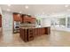 Spacious kitchen featuring a large island with custom wood cabinets and stainless steel appliances at 1216 E Rocky Slope Dr, Phoenix, AZ 85048