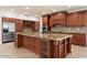 Spacious kitchen boasts custom wood cabinets, granite countertops, and stainless steel appliances at 1216 E Rocky Slope Dr, Phoenix, AZ 85048