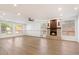 Expansive living room boasts wood floors, recessed lighting, and a stone fireplace at 1216 E Rocky Slope Dr, Phoenix, AZ 85048