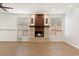 Spacious living area featuring hardwood floors and a stone fireplace at 1216 E Rocky Slope Dr, Phoenix, AZ 85048